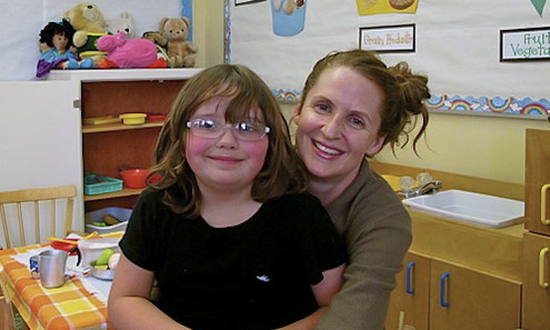 Teacher and Student in Classroom